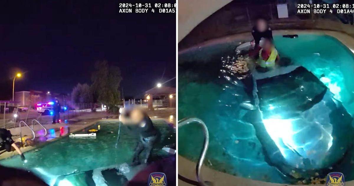 Dramatic video shows Phoenix police smash sunroof, saving man from car submerged in pool